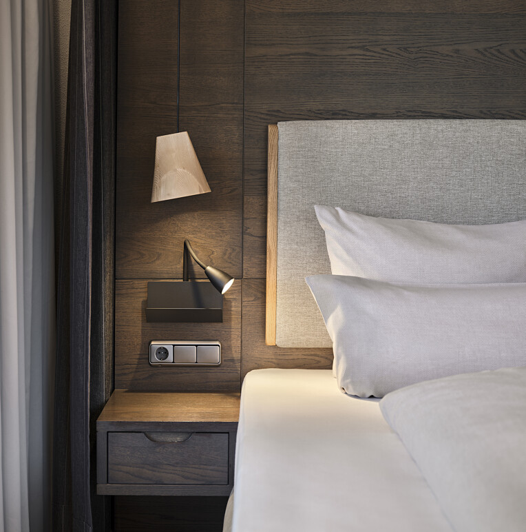 One of our rooms at the wellness hotel Allgäu The neatly made bed invites you to linger at the Allgäu wellness hotel